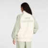 CAMPERA ROMPEVIENTO DAMA CREMA CON VERDE NEW BALANCE