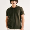 N3A7NATEN-01 REMERA POLO PIQUET CABALLERO VERDE OSCURO HERING